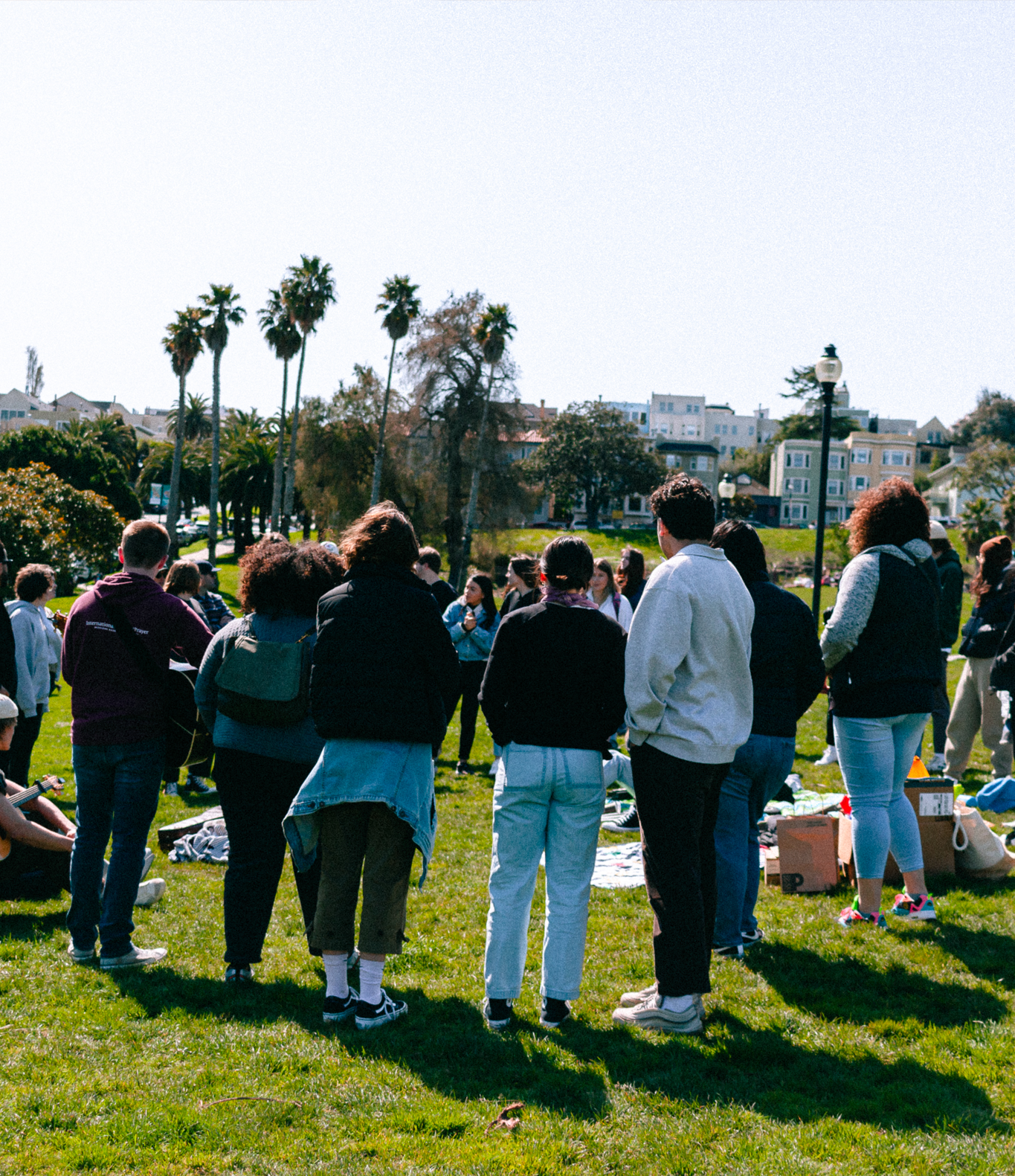 Community worship with hands raised